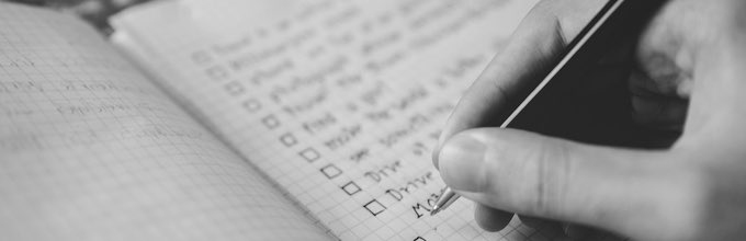 Woman Making List of Fashion to Buy in Boxing Day Sales