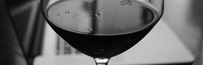 Woman Drinking Wine While Shopping Online